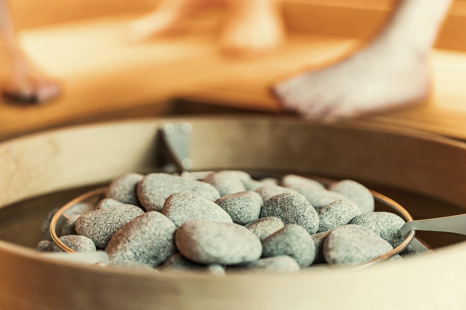 Close-up of sauna stones in a heater basket